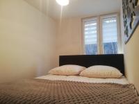 Posteľ alebo postele v izbe v ubytovaní Apartament Stella