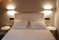 Posteľ alebo postele v izbe v ubytovaní Altar Suites Conde Luna by gaiarooms
