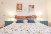 A bed or beds in a room at Casa Giovanetti