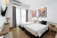 Postel nebo postele na pokoji v ubytování Darley Hotel Chiangmai
