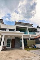 a large white house with a driveway at 75 pangkor ocean in Pangkor