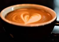 a cup of coffee with a heart painted on it at Kenaray Farmstay riverside in Kaeng Krachan