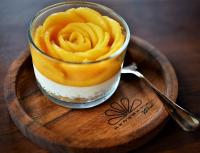 a dessert in a glass cup on a wooden plate at Kenaray Farmstay riverside in Kaeng Krachan