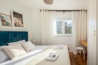 Posteľ alebo postele v izbe v ubytovaní Apartment with terrace and parking near beach