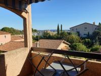 a view from the balcony of a house at Studio Mezzanine vue port et mer in La Londe-les-Maures