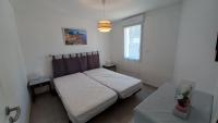 Łóżko lub łóżka w pokoju w obiekcie LES SILENES - Maison 3 chambres proche plage