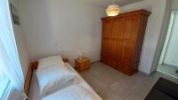 Łóżko lub łóżka w pokoju w obiekcie LES SILENES - Maison 3 chambres proche plage