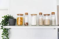 a shelf with glass jars filled with food items at Le Capé-Grand appartement avec terrasse et jacuzzi in Marseille