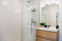 a bathroom with a shower with a sink and a mirror at Le Capé-Grand appartement avec terrasse et jacuzzi in Marseille