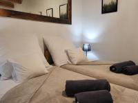 Posteľ alebo postele v izbe v ubytovaní Apartamenty Stylo
