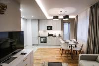 Telewizja i/lub zestaw kina domowego w obiekcie D Apartments Centrum Powietrze