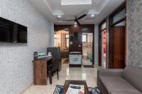 a living room with a couch and a table at TF Cozy Flats Bnb 2 BHK Flat,Near Airport Delhi in New Delhi