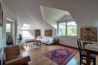 A seating area at I D'A Charming Penthouse - LAKE VIEW- Como- House-130 mt-2 double bedrooms and 2 double bathrooms a spacious living room-Full equipped kitchen-Private garden and terrace-Private covered parking