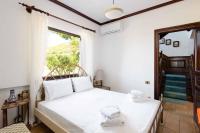Posteľ alebo postele v izbe v ubytovaní Malt Beachfront Villa