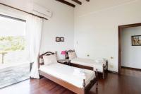 Posteľ alebo postele v izbe v ubytovaní Malt Beachfront Villa