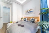 Łóżko lub łóżka w pokoju w obiekcie Premium Apartment La Latina