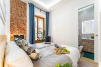 Łóżko lub łóżka w pokoju w obiekcie Premium Apartment La Latina