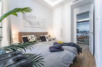 Łóżko lub łóżka w pokoju w obiekcie Premium Apartment La Latina