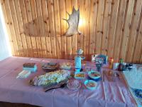 a table with a purple table cloth with food on it at Nederhögen Vildmarkscenter in Rätan