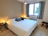 Łóżko lub łóżka w pokoju w obiekcie *VILLA PALMA* 5 suites parentales, plage à 600 m, Vieux-Boucau