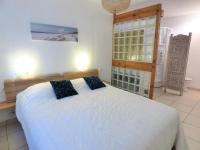 Łóżko lub łóżka w pokoju w obiekcie *VILLA PALMA* 5 suites parentales, plage à 600 m, Vieux-Boucau