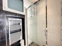 a shower in a bathroom with a glass door at Appartement Cannes, 2 pièces, 2 personnes - FR-1-470-27 in Cannes