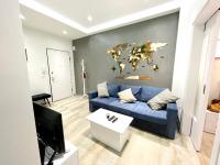 A television and/or entertainment centre at Dreamy Apartment City Center 11 thesbnbgr