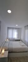 Postel nebo postele na pokoji v ubytování APARTAMENTOS TANEZ SANTURCE a