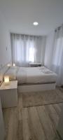 Postel nebo postele na pokoji v ubytování APARTAMENTOS TANEZ SANTURCE a