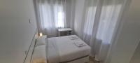 Postel nebo postele na pokoji v ubytování APARTAMENTOS TANEZ SANTURCE a