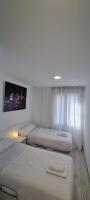 Postel nebo postele na pokoji v ubytování APARTAMENTOS TANEZ SANTURCE a
