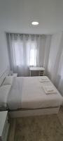 Postel nebo postele na pokoji v ubytování APARTAMENTOS TANEZ SANTURCE a