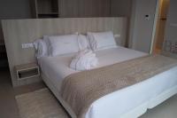 Postel nebo postele na pokoji v ubytování Otantus Hotel