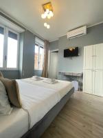 A bed or beds in a room at San Pietro Rooms 84