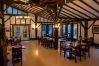 a restaurant with tables and chairs in a room at Benmiller Inn & Spa in Goderich
