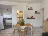 a kitchen and dining room with a wooden table and chairs at Les Gîtes d&#39;Angres - gîte n°1 in Angres