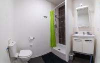 a bathroom with a toilet and a sink and a shower at Le Stratège in Marseille