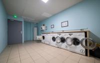 a laundry room with two washing machines in a room at Le Stratège in Marseille