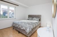 Posteľ alebo postele v izbe v ubytovaní APARTMAN SANDRA