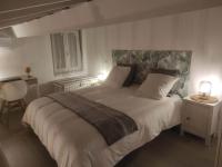 a bedroom with a large bed with two lamps at Chill Out Cabanon Coeur Calanques in Marseille
