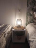 a small television sitting on a night stand next to a bed at Chill Out Cabanon Coeur Calanques in Marseille