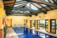 an indoor pool in a house with a ceiling at Hotel y Spa Getsemani in Villa de Leyva