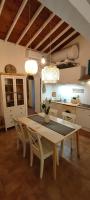 a kitchen with a table and chairs in a room at Chill Out Cabanon Coeur Calanques in Marseille