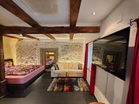 a living room with a couch and a tv at Studio am Vierwaldstättersee in Horw