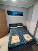 Postel nebo postele na pokoji v ubytování Apartament Goleta