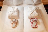 A bed or beds in a room at Hotel Chalet Sas Morin