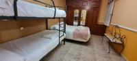 Postel nebo postele na pokoji v ubytování Apartamentos Los Robles