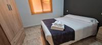 Postel nebo postele na pokoji v ubytování Apartamentos Los Robles