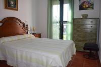 A bed or beds in a room at Apartamento en la Barrosa