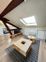 Televízia a/alebo spoločenská miestnosť v ubytovaní Pin's - Magnifique appartement